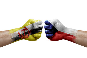 Two hands punch to each others on white background. Country flags painted fists, conflict crisis concept between brunei and czechia