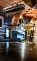 man hand bartender making cocktail on the bar counter