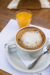 coffee with milk together with orange juice