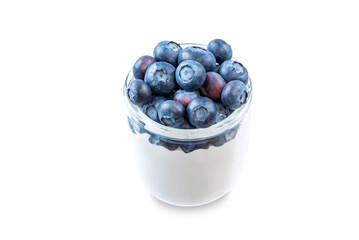 Greek yogurt with blueberries in a glass on a white isolated background