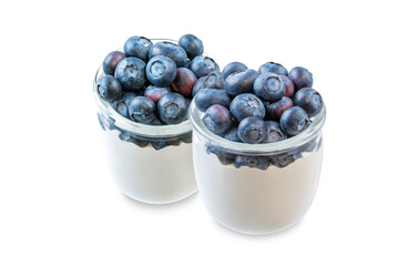 Greek yogurt with blueberries in a glass on a white isolated background