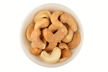 salted cashew nuts in bowl isolated on white background with clipping path