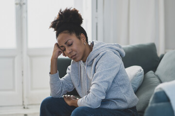 Young african american woman suffering from depression, anxiety and mental health illness