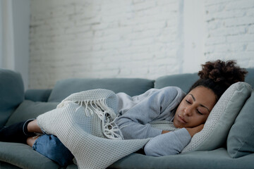 Sad black woman suffering from depression symptoms feeling distressed alone at home