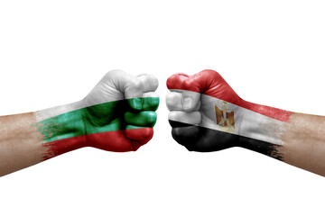 Two hands punch to each others on white background. Country flags painted fists, conflict crisis concept between bulgaria and egypt