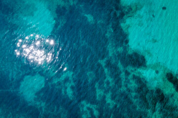 Surface of Ionian Sea, drone photo made in Benitses village in eastern part of Corfu Island in Greece