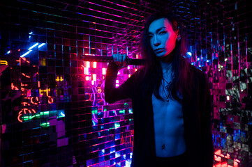 Male transgender neon light studio. Asian with samurai sword.