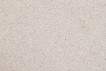 Natural craft paper texture, light grey cardboard background close-up