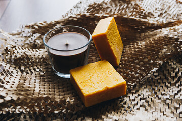 Candles burning in the dark against decorated on wood and Natural made soap