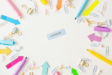 Stationery, school supplies on a white table in bright pastel colors. Inscription.