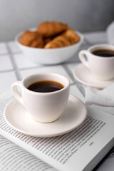 coffee and croissants, chocolate cream, french press on the table, morning breakfast 