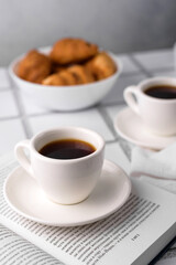 coffee and croissants, chocolate cream, french press on the table, morning breakfast 