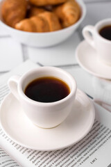 coffee and croissants, chocolate cream, french press on the table, morning breakfast 