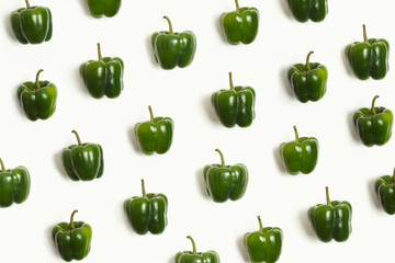 Pattern of green bell peppers on white background