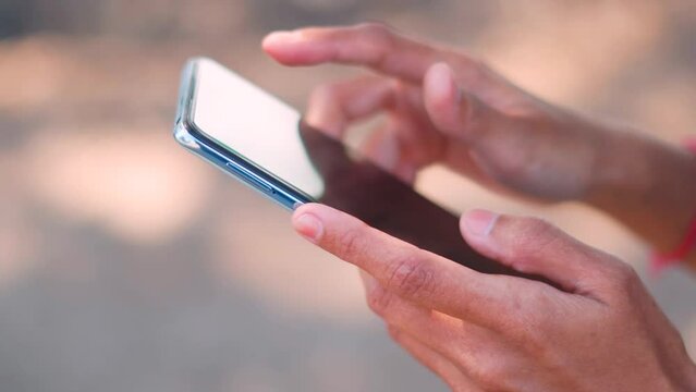 Close up shot of female hands using mobile phone. woman replying business emails via mobile. 