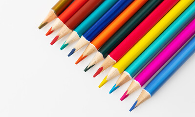 Close-up macro shot of colored pencils of a pile of pencils. Place for an inscription.