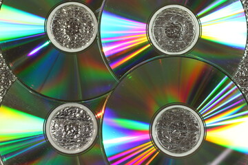 Compact disc, CDs with colorful glare, as background, texture.