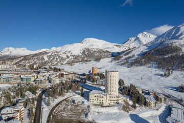 Aerial view of Sestriere village from above, famous ski resort in the italian western Alps,...