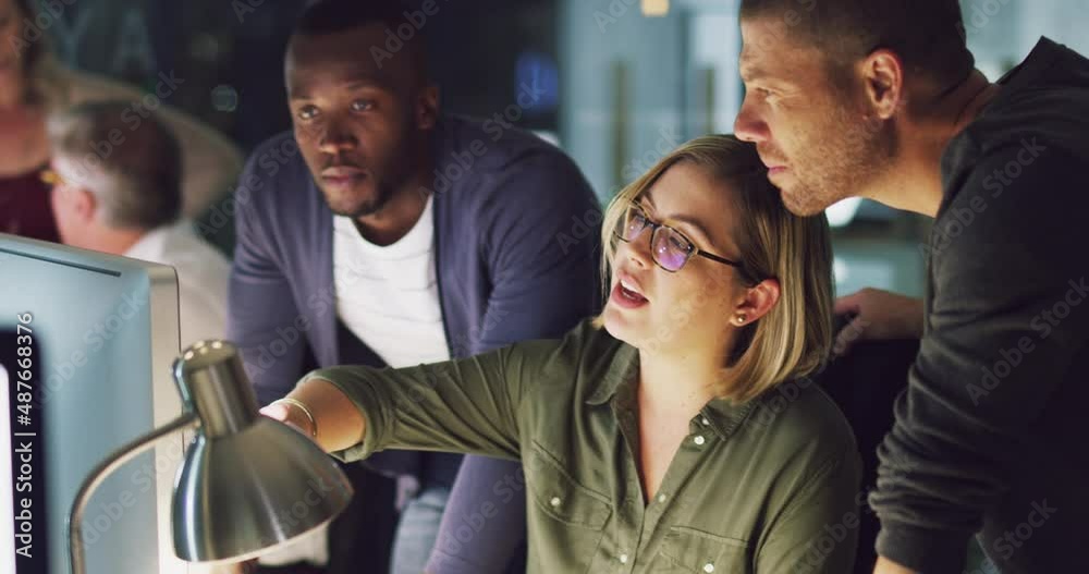 Poster outlining her ideas to the team. 4k video of a group of businesspeople working late on a computer in