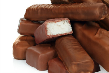 Heap of chocolate bars on white background