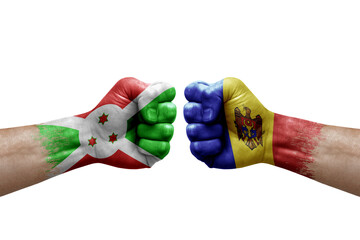 Two hands punch to each others on white background. Country flags painted fists, conflict crisis concept between burundi and moldova