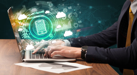 Business hand typing on a modern laptop