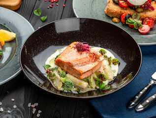 Grilled salmon steak in a creamy sauce.