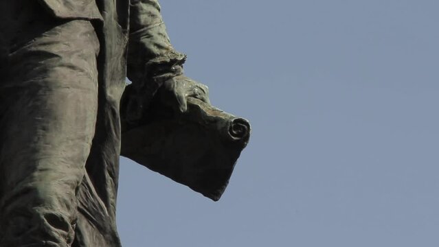 Bronze Statue depicting Bernardo de Monteagudo Holding a Papyrus in a Public Park in Buenos Aires, Argentina. Close Up. 