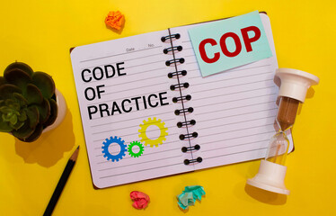 text Code of Practice on envelope on keyboard on white background