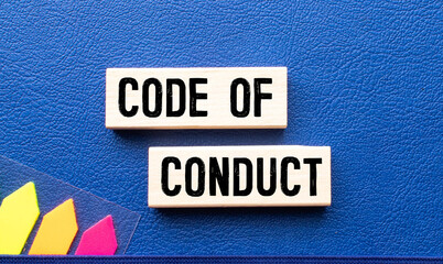 Code of conduct symbol. Concept words Code of conduct on wooden blocks on a beautiful white table...