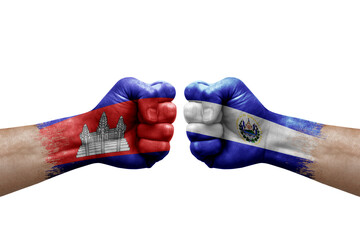 Two hands punch to each others on white background. Country flags painted fists, conflict crisis concept between cambodia and el salvador