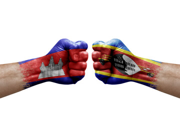 Two hands punch to each others on white background. Country flags painted fists, conflict crisis concept between cambodia and eswatini