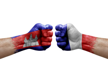 Two hands punch to each others on white background. Country flags painted fists, conflict crisis concept between cambodia and france