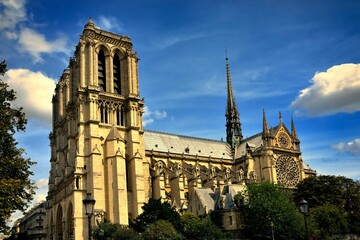 Fototapeta na wymiar Cathedral of Notre-Dame in Paris feather clouds blue sky side view