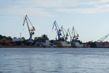 Fototapeta na wymiar The ship is moored on the waterfront near the shipyard, a cargo ship.
