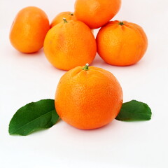fresh tangerine or mandarin orange fruit with leaves isolated on white background