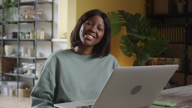 A lady is looking at the camera and smiling