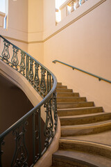 Warm light bouncing around spiral stairs