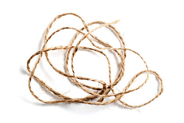 Piece of jute twine isolated on white background. Natural rope for packaging and decoration. Coarse...