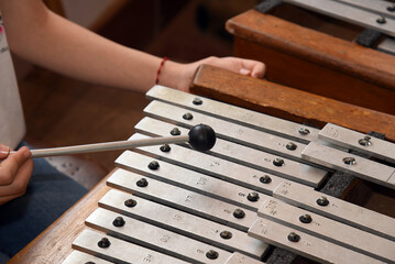 xylophone, percussion instrument, closed on wooden bars. selective focus