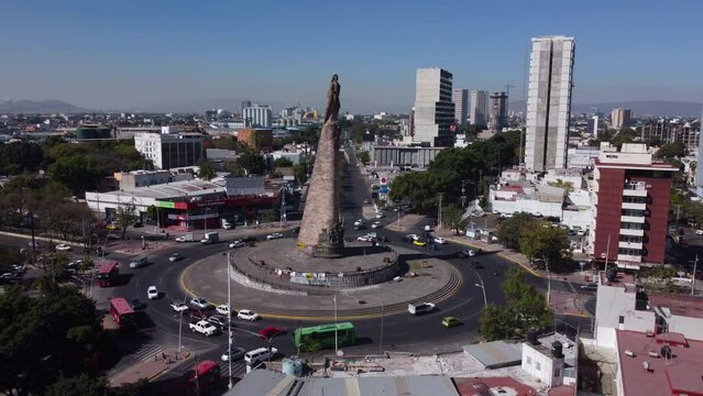 wide flying clockwise around Monumento a los Ninos Heroes in Guadalajara