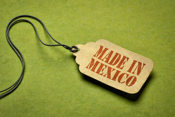 made in Mexico sign - red stencil text on a price tag against green textured paper
