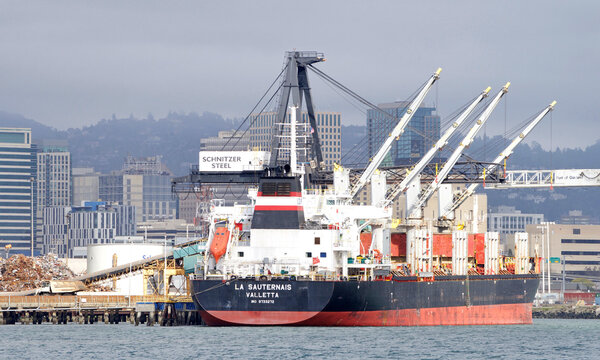 Oakland, CA - Feb 14, 2022: Bulk carrier LA SAUTERNAIS loading at Schnitzer&nbsp;Steel at the Port of Oakland. They recycle scrap metal into finished steel products