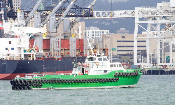 Oakland, CA - Feb 14, 2022: Passenger Vessel MISS TAMMY traveling through the Middle Harbor past the Port of Oakland.