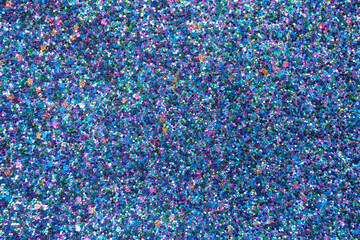 Many multi-colored, purple shiny stars as a background, texture