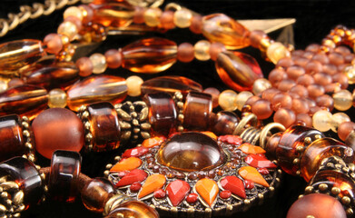 Necklaces and Bracelets on Black Background, Close-up