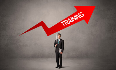 Fototapeta premium Young business person in casual holding road sign