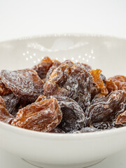 A bowl of pickled sweet and sour dried plum