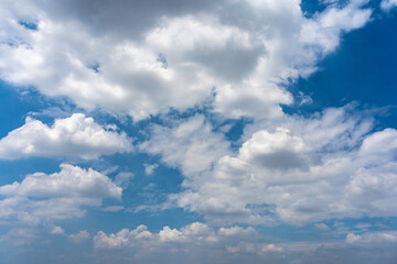 Naklejka na ściany i meble Beautiful blue sky background with white clouds floating