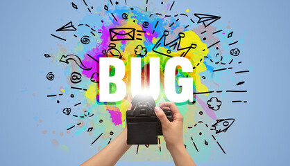 Close-up of a hand holding digital camera with abstract drawing